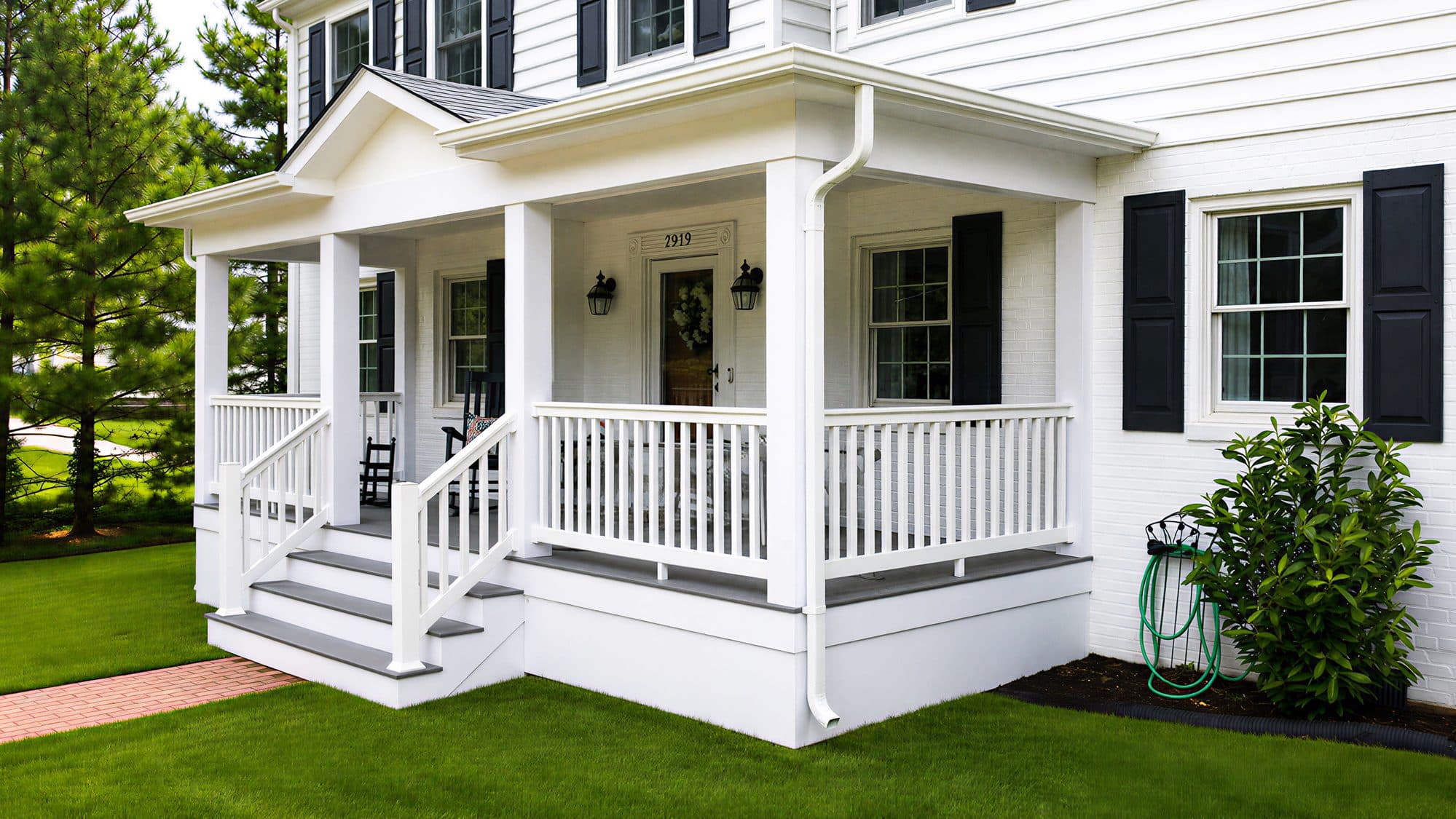 Front porch renovation in Mount Vernon, VA, white railings and black shutters