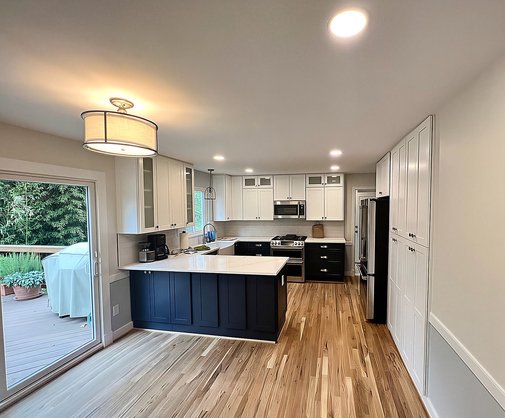 Kitchen renovation project, white cabinetry, hardwood floors