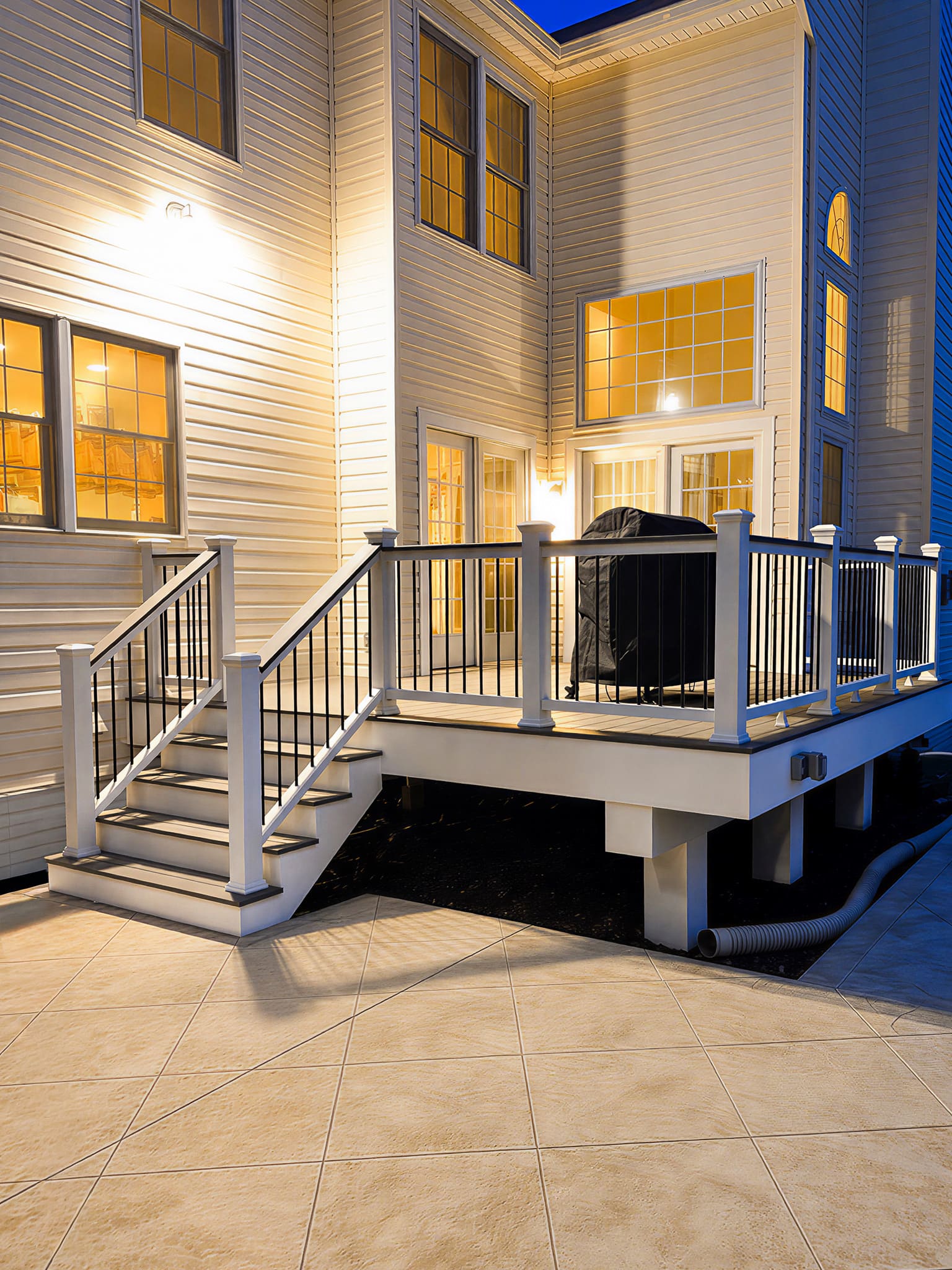 Outdoor deck illuminated at dusk with warm ambient lighting