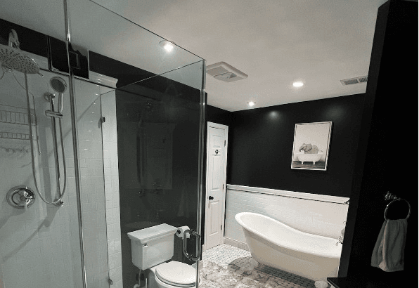 Luxury master bathroom renovation, marble tile work, frameless glass shower